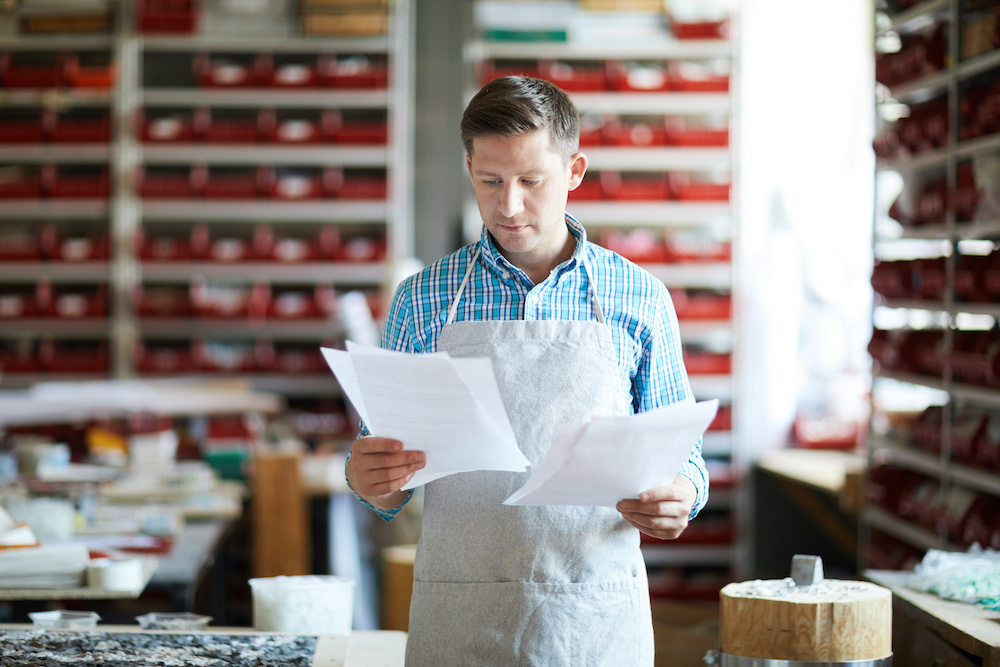 employer reviewing bills
